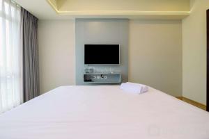 Nice and Elegant 1BR at The Kensington Royal Suites Apartment By Travelio
