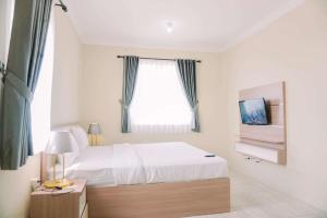 Wonderful and Homey 2BR at Grand Palace Kemayoran Apartment By Travelio
