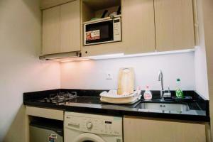 Nice and Comfy 1BR at The Mansion Kemayoran Apartment By Travelio