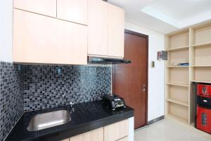 Cozy Stay 1BR at Sky Terrace Apartment By Travelio