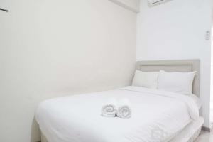 Restful and Simply Studio Apartment Green Palm Residence By Travelio