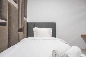 Nice and Comfort 1BR at Citralake Suites Apartment By Travelio