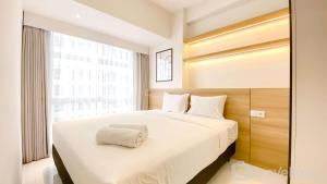 Nice and Comfortable 2BR at 20th Floor Tokyo Riverside Apartment By Travelio