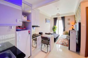 Homey and Warm 2BR at Signature Park Grande Apartment By Travelio