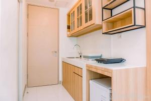 Comfy Studio at 30th Floor Tokyo Riverside PIK 2 Apartment By Travelio