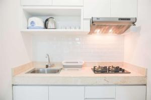 Modern and Homey 2BR at MT Haryono Square Apartment By Travelio