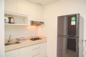 Modern and Homey 2BR at MT Haryono Square Apartment By Travelio