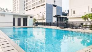 Best Price and Restful Studio at Tifolia Apartment By Travelio