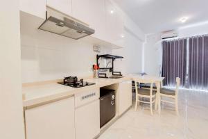 Spacious and Comfortable 2BR at Sky House BSD Apartment By Travelio