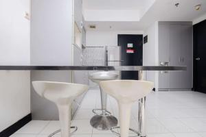 Nice and Elegant 1BR at The Wave Kuningan Apartment By Travelio
