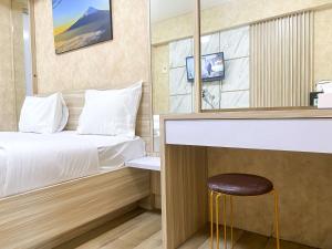 Minimalist Studio (No Kitchen) at Green Bay Pluit Apartment By Travelio