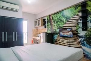 Warm and Cozy Stay Studio Green Bay Pluit Apartment By Travelio