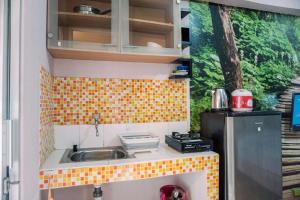 Warm and Cozy Stay Studio Green Bay Pluit Apartment By Travelio