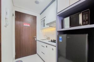Homey and Nice Studio at Transpark Bintaro Apartment By Travelio