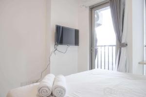Comfort and Warm Studio at Ciputra World 2 Apartment By Travelio