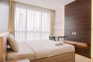 Spacious and Warm 2BR at Ciputra World 2 Apartment By Travelio