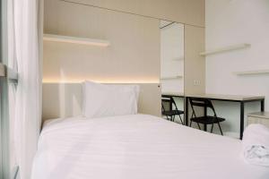 Spacious and Warm 2BR at Ciputra World 2 Apartment By Travelio