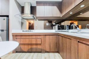 Homey and Modern 2BR at Casa de Parco Apartment By Travelio