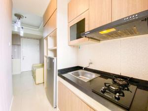 Homey Apartment with 1BR at Parahyangan Residence By Travelio