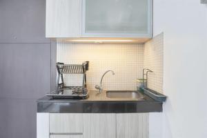 Simply Modern 1BR at Sky Terrace Apartment By Travelio