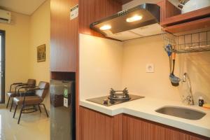 Best and Homey Studio at Transpark Bintaro Apartment By Travelio