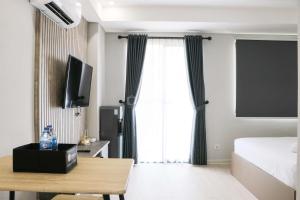 Spacious and Homey Studio at Daan Mogot City Apartment By Travelio