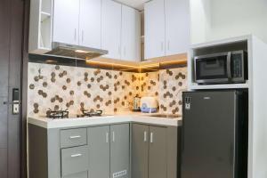 Spacious and Homey Studio at Daan Mogot City Apartment By Travelio