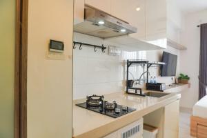 Cozy and Well Furnished Studio Sky House BSD Apartment By Travelio