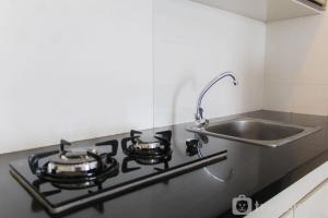 Clean and Comfort 2BR Apartment M-Town Residence By Travelio