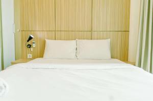 Comfort and Minimalist 1BR at Tree Park City BSD Apartment By Travelio