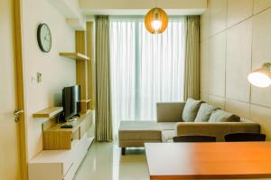 Comfort and Minimalist 1BR at Tree Park City BSD Apartment By Travelio