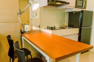 Comfort and Minimalist 1BR at Tree Park City BSD Apartment By Travelio