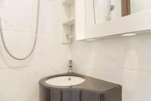 Well Furnished and Homey Studio Sky House Alam Sutera Apartment By Travelio