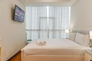 Nice and Warm 2BR Apartment Casa Grande Residence By Travelio