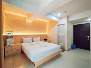 Cozy Style Studio Room at Jarrdin Cihampelas Apartment By Travelio