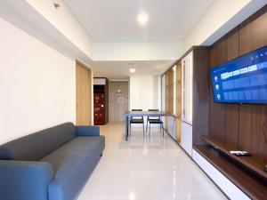 Spacious and Homey 2BR with Extra Room at Meikarta Apartment By Travelio