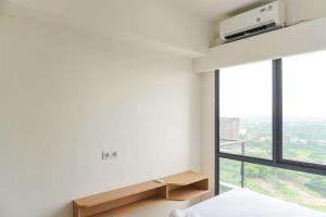 Serene and Modern 2BR Sky House BSD Apartment near AEON By Travelio