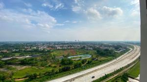 Serene and Modern 2BR Sky House BSD Apartment near AEON By Travelio