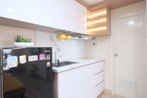 Spacious 2BR Combined Tokyo Riverside PIK 2 Apartment By Travelio