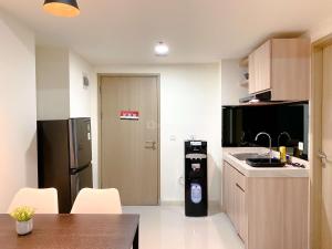 Homey 2BR with Work Space at Meikarta Apartment By Travelio