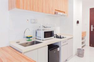 Comfort Stay 2BR at Sky House BSD Apartment near AEON By Travelio