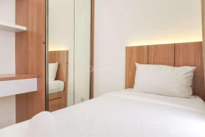 Good Deal and Cozy 2BR Apartment M-Town Residence near Mall By Travelio