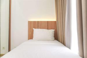 Good Deal and Cozy 2BR Apartment M-Town Residence near Mall By Travelio