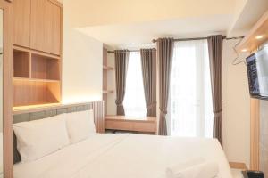 Fully Furnished with Cozy Design Studio Tokyo Riverside PIK 2 Apartment By Travelio