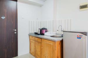 Comfy and Warm Studio Serpong Greenview Apartment By Travelio