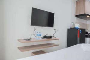 Simple and Cozy Living Studio at Serpong Garden Apartment By Travelio