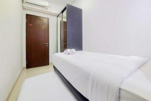 Best Price and Homey 2BR at Transpark Bintaro Apartment By Travelio