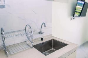 Studio with Cozy Design at Sky House BSD Apartment By Travelio