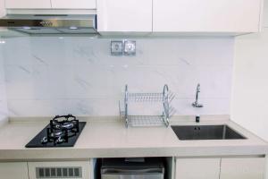 Studio with Cozy Design at Sky House BSD Apartment By Travelio