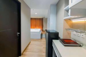 Great Deal and Homey Studio Room Patraland Amarta Apartment By Travelio